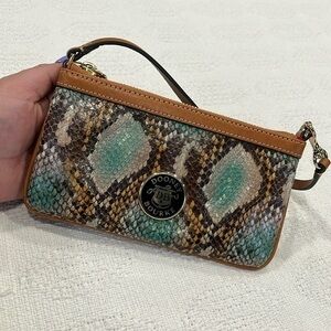 Dooney & Bourke snake and‎ ball leather wristlet interior red used